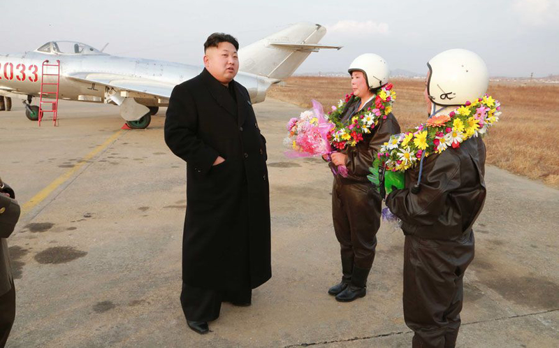 Illustration for article titled Kim Jong Un Visits Female Fighter Pilots, Picks Up Camera For Photo Op